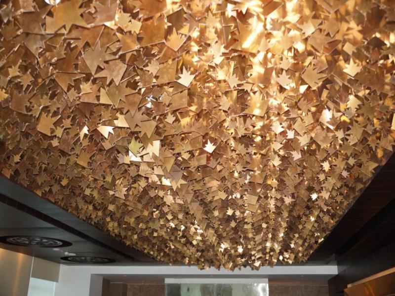 CNC Laser Cut Stars and Leaves hanged to Ceiling in PVD Rose Gold Stainless Steel Finish