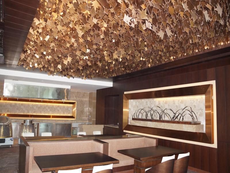 CNC Laser Cut Stars and Leaves hanged to Ceiling in PVD Rose Gold Stainless Steel Finish